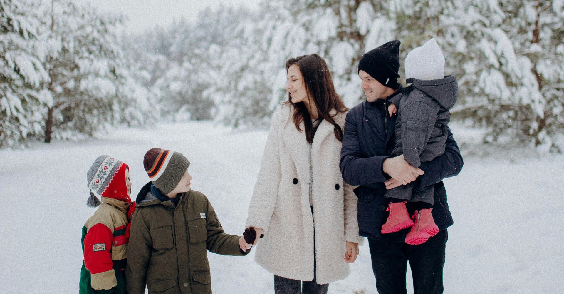 a family walking in the snow
